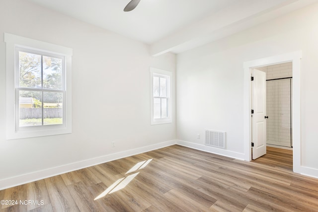 spare room featuring ceiling fan and light hardwood / wood-style floors