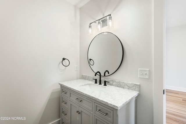 bathroom featuring vanity and hardwood / wood-style flooring