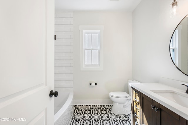 bathroom featuring tile patterned flooring, vanity, and toilet