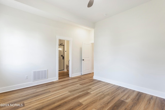 empty room featuring ceiling fan and light hardwood / wood-style flooring