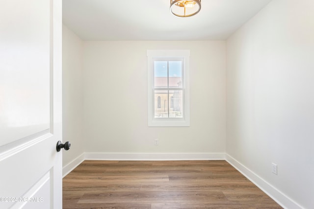 empty room featuring wood-type flooring