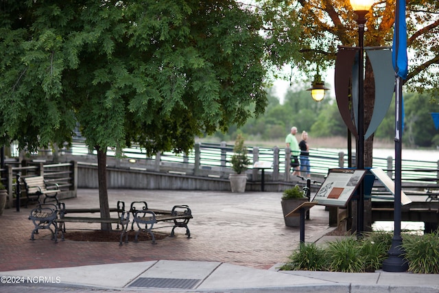 surrounding community featuring a water view