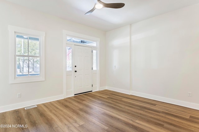 entrance foyer with ceiling fan and wood-type flooring