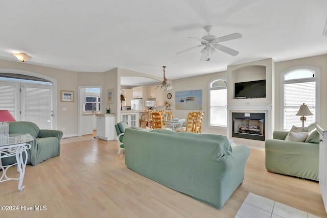 living room featuring ceiling fan and light wood-type flooring