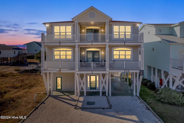 exterior space featuring a carport and a balcony