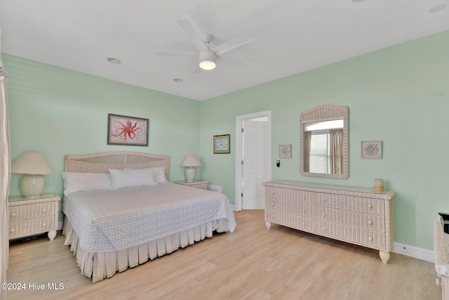 bedroom with ceiling fan and light wood-type flooring