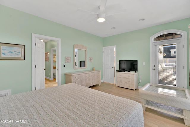 bedroom featuring access to exterior, ceiling fan, and light hardwood / wood-style flooring