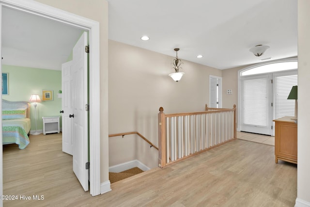 corridor featuring light hardwood / wood-style floors