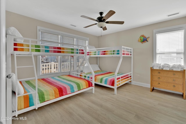 bedroom featuring hardwood / wood-style flooring and ceiling fan