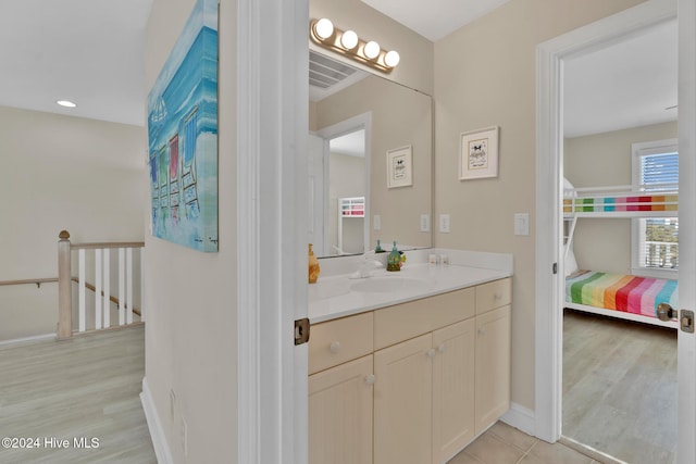 bathroom with vanity and hardwood / wood-style flooring