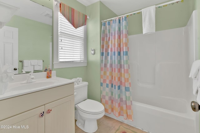 full bathroom with tile patterned flooring, vanity, toilet, and shower / tub combo