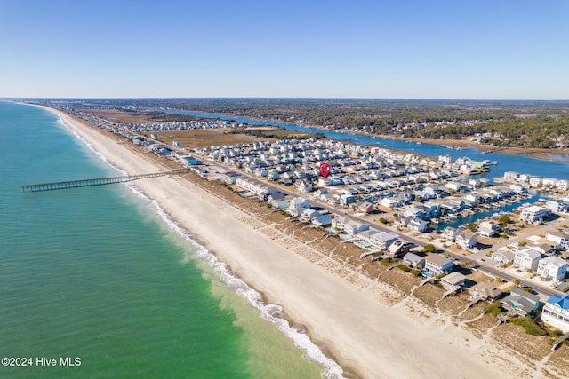 bird's eye view with a water view and a view of the beach