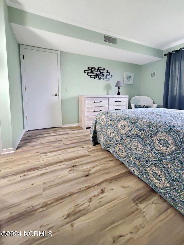 bedroom with light hardwood / wood-style floors