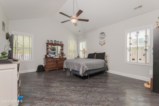 bedroom with ceiling fan, high vaulted ceiling, multiple windows, and dark hardwood / wood-style flooring