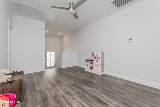 unfurnished room featuring ceiling fan and dark hardwood / wood-style flooring