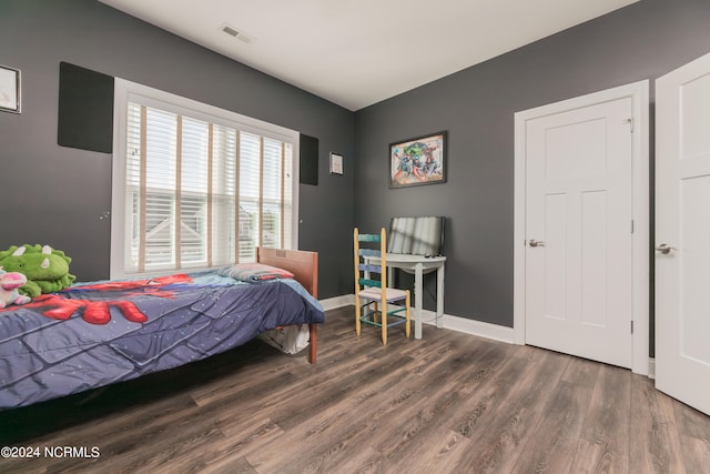 bedroom featuring dark hardwood / wood-style floors