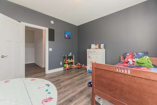 bedroom featuring dark hardwood / wood-style floors