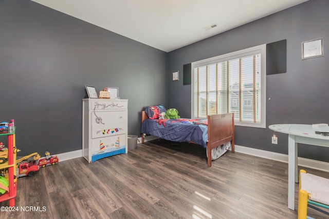 bedroom featuring dark wood-type flooring