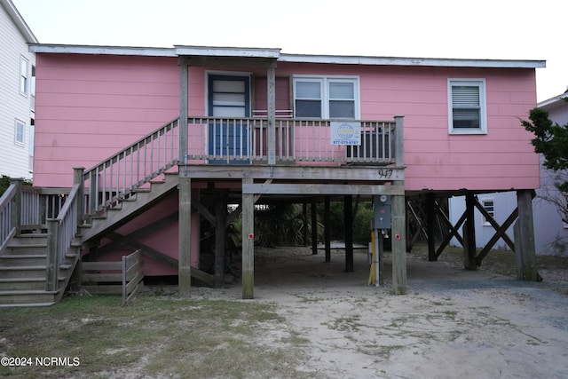 rear view of house featuring a carport