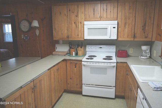 kitchen with white appliances and sink