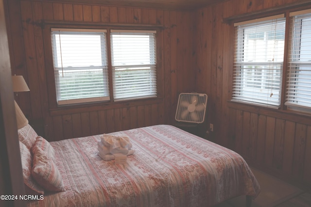 bedroom with wooden walls