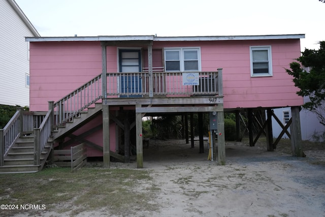 rear view of house with a carport