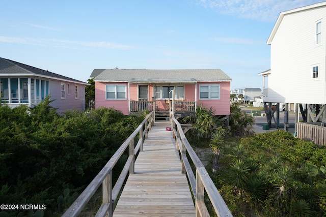 back of property with covered porch