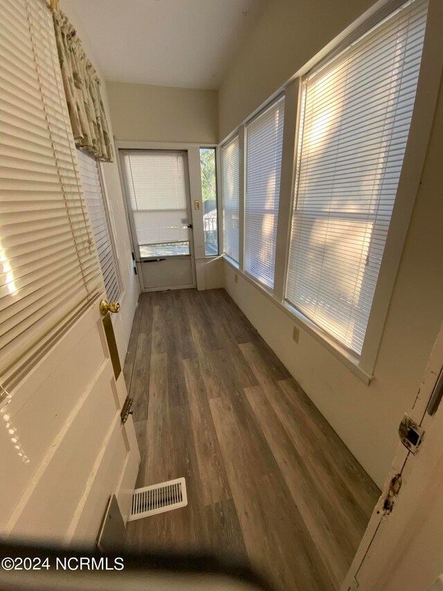 interior space with dark hardwood / wood-style flooring