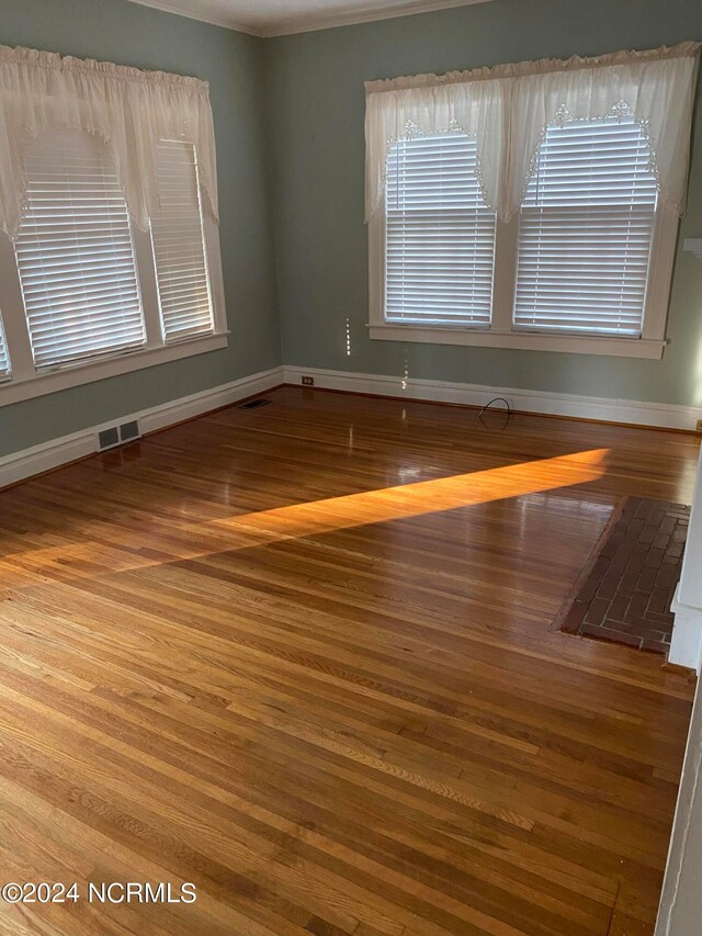 empty room featuring hardwood / wood-style flooring