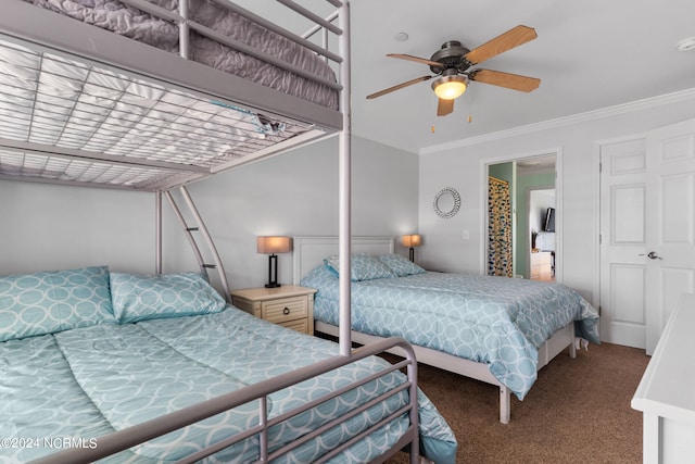 carpeted bedroom featuring ornamental molding and ceiling fan