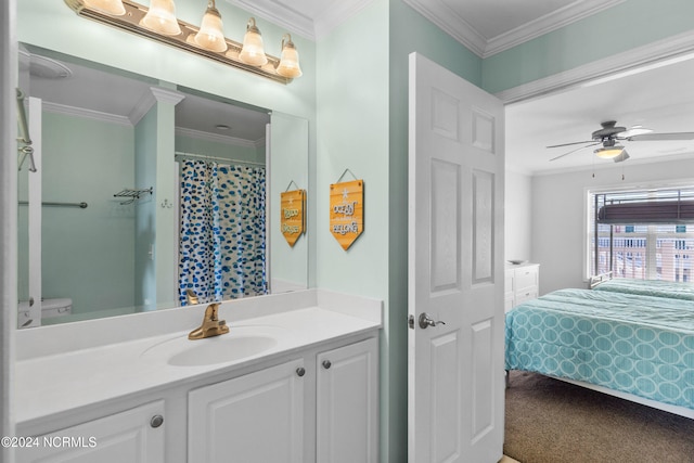 bathroom with a shower with shower curtain, toilet, ceiling fan, vanity, and crown molding