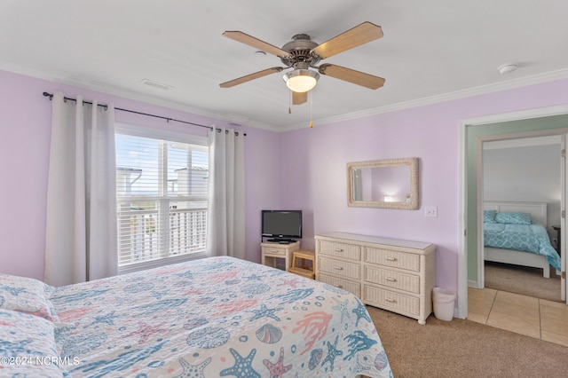 bedroom with ornamental molding, light colored carpet, and ceiling fan