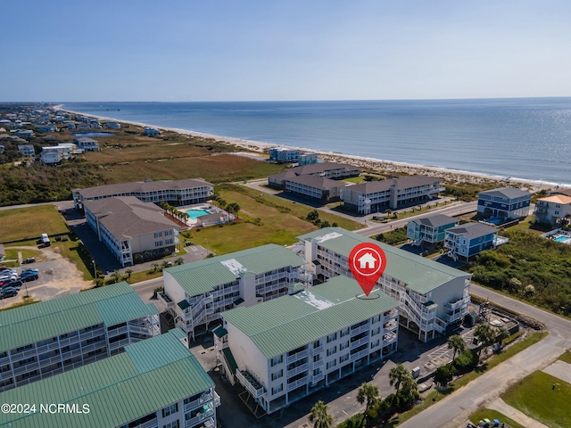 bird's eye view with a water view and a beach view