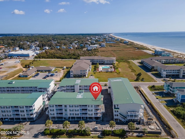 drone / aerial view with a water view and a beach view