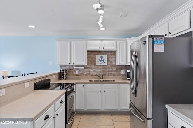 kitchen with sink, white cabinets, stainless steel appliances, and light tile patterned floors