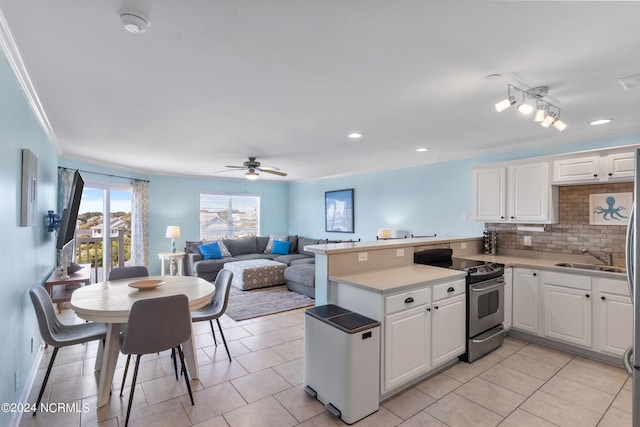 kitchen with white cabinetry, electric stove, ornamental molding, and kitchen peninsula