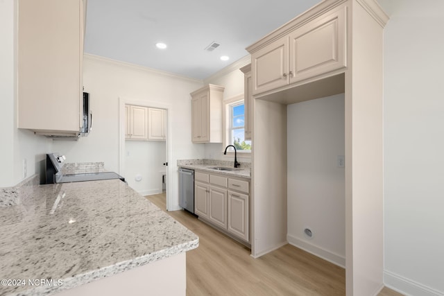 kitchen with appliances with stainless steel finishes, light stone countertops, light hardwood / wood-style flooring, ornamental molding, and sink