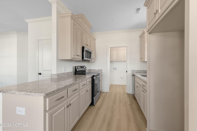 kitchen with crown molding, appliances with stainless steel finishes, cream cabinets, light wood-type flooring, and light stone counters