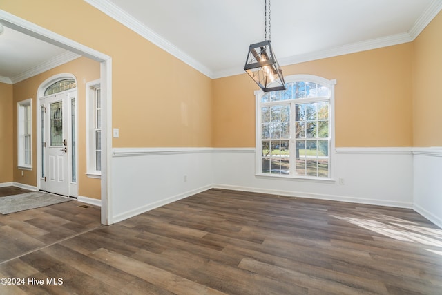 unfurnished dining area with crown molding and dark hardwood / wood-style floors