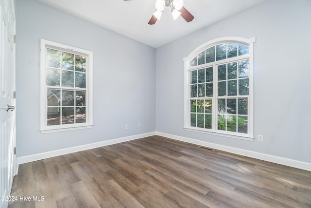 spare room featuring hardwood / wood-style flooring and ceiling fan