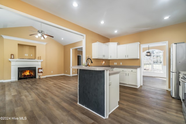 kitchen featuring white cabinetry, ceiling fan, vaulted ceiling, and dark hardwood / wood-style flooring