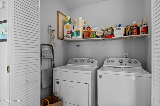 laundry area featuring washing machine and clothes dryer