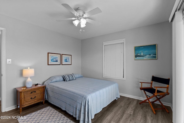 bedroom featuring ceiling fan and dark hardwood / wood-style flooring