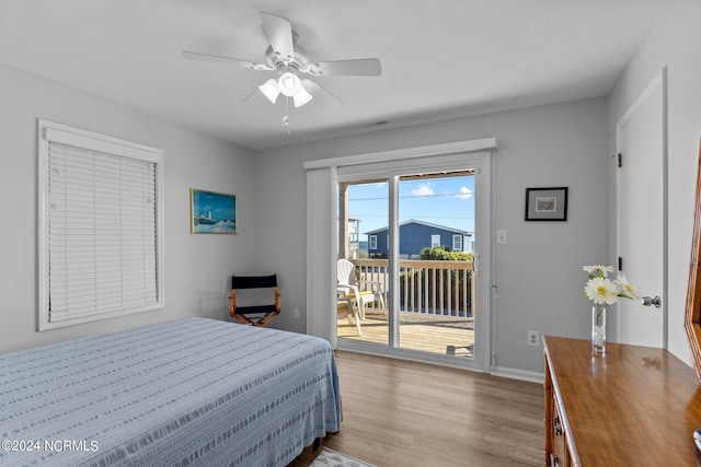 bedroom with light hardwood / wood-style flooring, access to outside, and ceiling fan