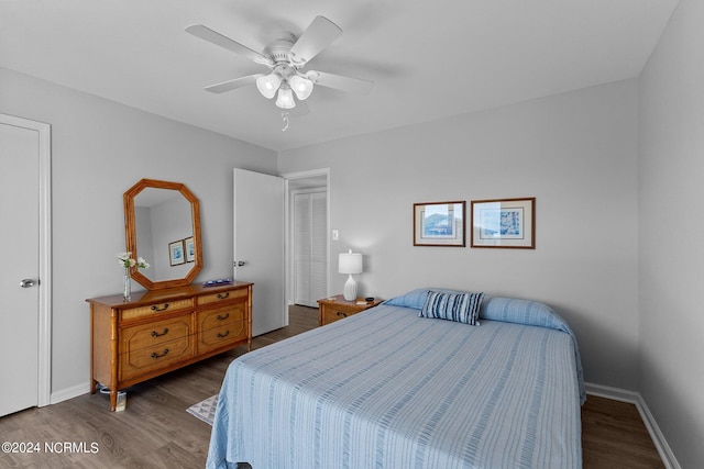 bedroom with hardwood / wood-style floors and ceiling fan