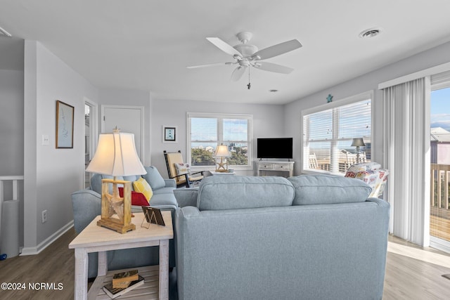 living room featuring hardwood / wood-style flooring and ceiling fan