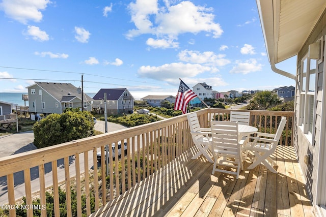 wooden deck featuring a water view