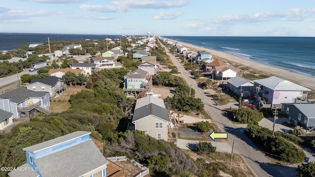 birds eye view of property featuring a view of the beach and a water view