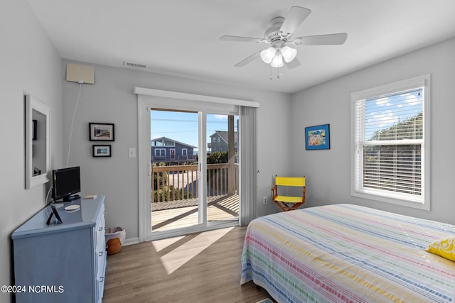 bedroom featuring ceiling fan, hardwood / wood-style floors, and access to exterior