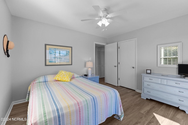 bedroom with ceiling fan and hardwood / wood-style floors